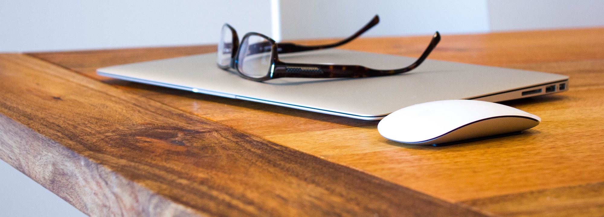 Desk with laptop on devils advocate post
